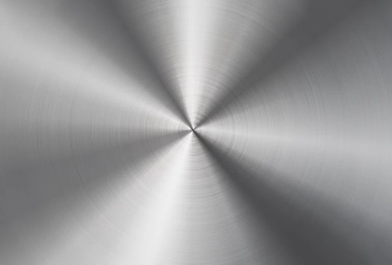 Brushed stainless steel surface with a radial grain pattern