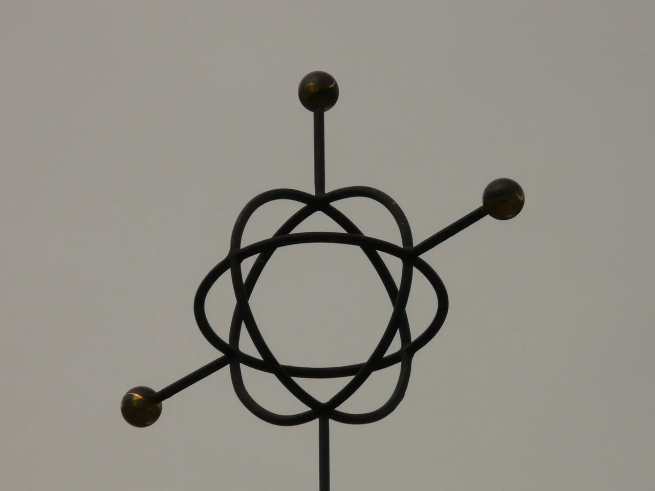 Abstract atomic model symbol on a textured surface