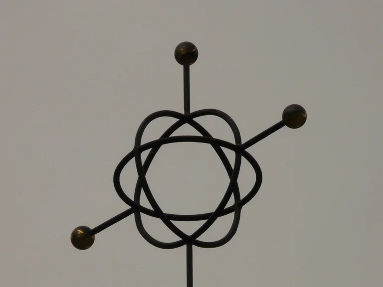 Abstract atomic model symbol on a textured surface