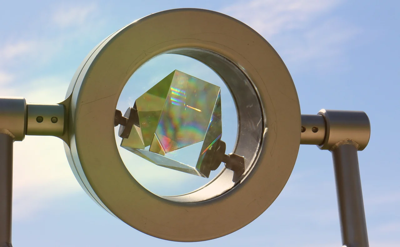 A glass prism showing spectral colors from light