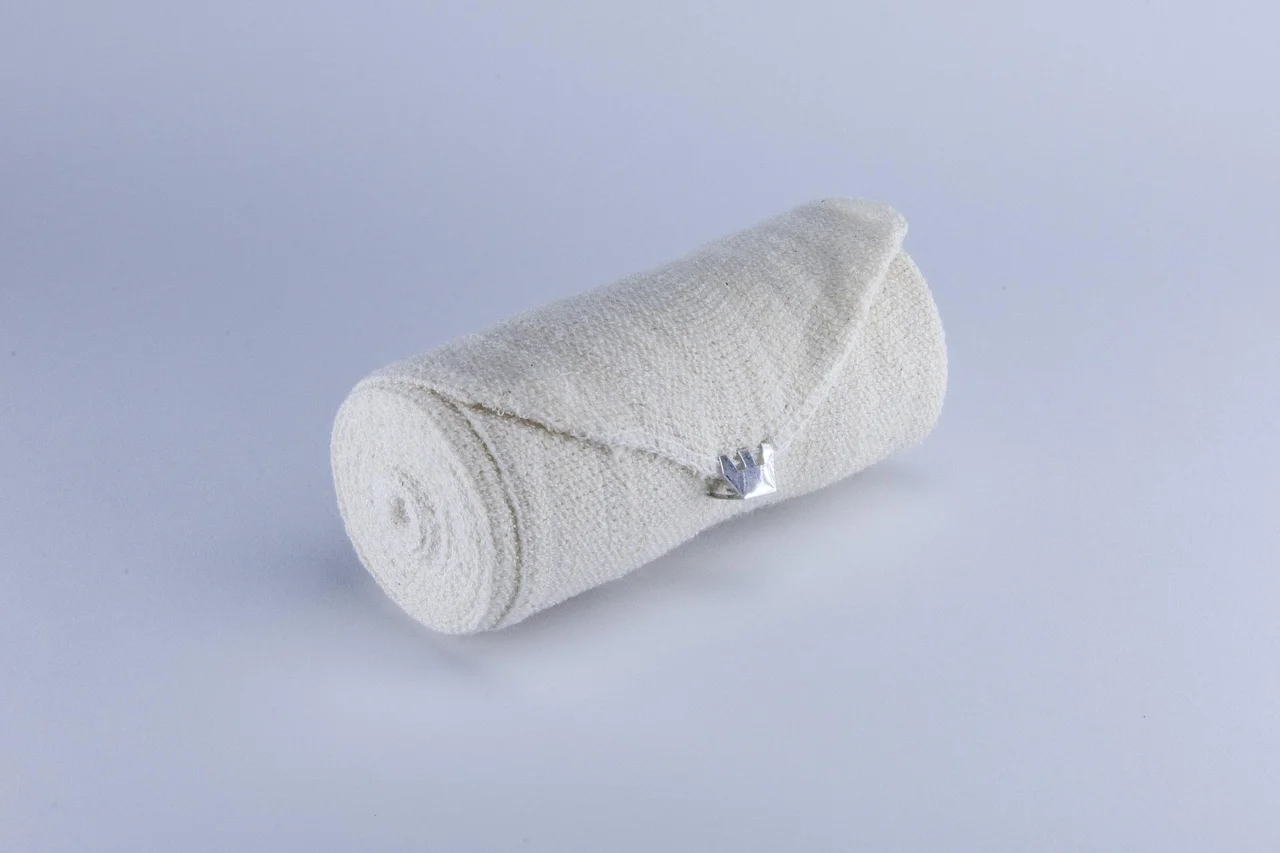 Rolled gauze bandage on a white background
